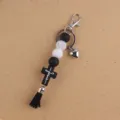 Silicone beaded keychain with cross tassel pendant, creative bag charm for daily use. - Black and White
