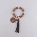 Bracelet porte-clés en perles de silicone avec pampille en bois, vue principale. - Café Foncé
