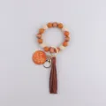 Silicone beaded keychain with leather tassel and wooden tag, stylish wristlet key ring accessory. - Light Coffee