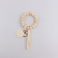 Silicone bead wristlet keychain with wooden charm and tassel for stylish women daily use - Natural