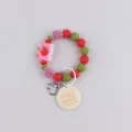 Silicone beaded keychain bracelet with pink notebook charm and handmade engraved disc pendant. - Apple and Book
