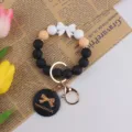 Silicone bead wristlet keychain with bow charm, handmade style key ring for women and girls. - Black