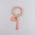 Silicone beaded keychain bracelet with pink leather tassel and handmade tag pendant. - Pink