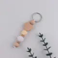 Wooden heart keychain, handmade bag charm with crochet ball and silicone bead variant. - Nude