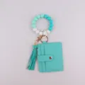 Bracelet porte-clés en perles de silicone avec étui pour carte et portefeuille à gland. - Vert