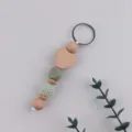 Wooden heart keychain with green silicone and crochet beads, handmade cute bag charm. - Sage Green
