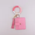 Porte-clés bracelet en perles de silicone dégradé rose avec étui à cartes cuir. - Rose