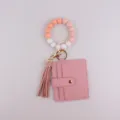 Bracelet porte-clés en perles de silicone avec porte-carte en cuir PU rose et pendentif gland. - Rose Lotus