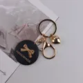 Handgemachter Holz Schleife Schlüsselanhänger mit Gold Herz Anhänger, schicke Tasche Deko. - Schleife Schwarz