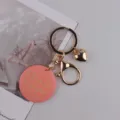 Handgemachte rosa runde Anhänger Schlüsselanhänger mit Herz-Charme und goldenem Verschluss - Smiley Rosa