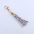 Goldfarbener Metallschlüsselanhänger mit 8cm Lederquaste im Leoparden-Look, stylisch. - Leopardenprint