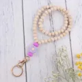 Holzperlen Lanyard Schlüsselanhänger mit lila Silikon Gänseblümchen Anhänger süsser Ring. - Lila