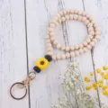 Holzperlen Sonnenblume Lanyard Detail, Silikon Gänseblümchen Anhänger und Goldverschluss. - Gelb