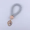 Silicone bead wristlet keychain with natural wood bead and gold metal clasp for keys. - Light Gray