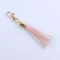 Goldgerahmter rosa-weisser Leder Quasten-Schluesselanhaenger, 8cm stilvolles Taschenaccessoire. - Hellrosa