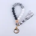 Silicone Beaded Wristlet Keychain with Cow Print Beads and Leather Tassel Detail - Cow