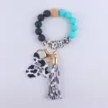 Silicone bead wristlet keychain with cow print tassel and mama cow head wooden pendant. - Lake Blue