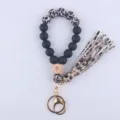 Silicone beaded wristlet keychain with leopard tassel and wooden eye bead for women. - Leopard Print