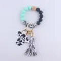 Silicone bead wristlet keychain with cute cow print, wooden bead and leather tassel charm. - Mint Green