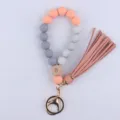 Silicone beaded wristlet keychain with leather tassel and eye wooden charm for keys. - Rose Red