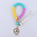 Silicone bead wristlet keychain with wooden eye cube and white tassel for daily use. - Lake Blue