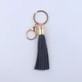Schwarzer Leder Quasten Schlüsselanhänger mit goldenem Metallverschluss, 8cm Taschenanhänger. - Schwarz