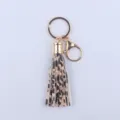 Leopardenmuster Leder Quasten Schlüsselanhänger mit goldfarbener Hardware, modischer Taschenanhänger. - Leopardenmuster