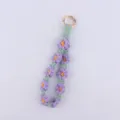Handcrafted knitted daisy keychain, purple and green cotton rope key lanyard variant. - Purple