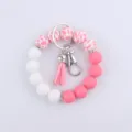 Porte-clés bracelet en perles de silicone avec gland vue détaillée et fermoir élégant. - Pétale