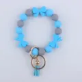 Bracciale portachiavi di perle di silicone con fiocchi blu e nappa per donne e ragazze. - Blu