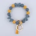 Portachiavi braccialetto in perline di silicone con fiocchi e nappe carini per donna. - Grigio