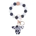 Silicone bead wristlet keychain with black white beads and cow print pendant for women. - Black