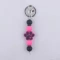 Llavero de cuentas de silicona con bonito colgante de huella de perro, negro y rosa. - Rosa rojo
