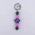 Llavero de cuentas de silicona bonito con colgante de pata para bolso y llaves. - Púrpura