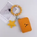 Yellow silicone bead wristlet keychain with cute star pendant and PU leather card holder wallet. - Turmeric