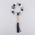 Black and white silicone bead keychain bracelet with cute dog paw charm and leather tassel. - Black