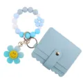 Blaues Silikon Perlen Armband Geldbörse mit niedlichem Smiley Blumen Schlüsselanhänger. - Blau