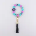 Colorful silicone bead keychain with cute dog paw pendant and black tassel variant. - Purple
