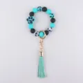 Silicone bead wristlet keychain with cute paw print charm and leather tassel for keys. - Green