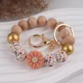 Gänseblümchen Silikonperlen Schlüsselanhänger Armband, handgemachtes Holzperlen Geschenk für Tasche. - Pfirsichrot