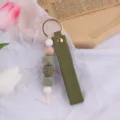 Portachiavi in pelle fatto a mano con perline di silicone e legno per borse o auto - verde pisello