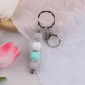 Handgemachter Silikon Perlen Schlüsselanhänger mit Strass Abstandsringen und Metallring. - Grün
