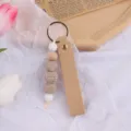 Portachiavi in pelle fatto a mano con perline in silicone legno, grazioso ciondolo borsa. - Cachi