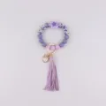 Lila Silikon Perlen Schlüsselanhänger mit Blumen Anhänger und Quoste, modisches Armband. - Begonienviolett