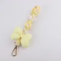 Handmade Yellow Woven Daisy Phone Charm with Soft Cotton Bow Keychain for Handbags - Yellow