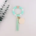 Silicone bead wristlet keychain in mint green and white with wooden charm and leather tassel. - Mint Green