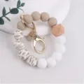 Silicone beaded wristlet keychain with wooden geometric bead and gold hardware for women. - Taupe