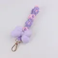 Woven phone charm with purple stuffed bow and daisy flowers, cute braided keychain for bags. - Purple