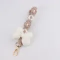 Handmade woven phone charm with white stuffed bow and daisy flowers, cute bag keychain. - White