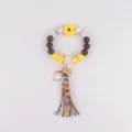 Silikon Perlen Armband Schlüsselanhänger mit Sonnenblume, braun und gelb, Leder Quaste Stil. - Gänseblümchen Gelb & Kaffee